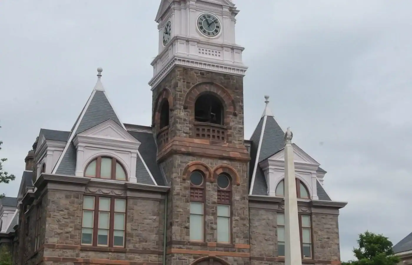 A historic stone courthouse in South Jersey with a prominent central clock tower, typical of the structures often maintained by local painting professionals.